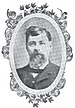 Head of a white man with bushy beard and thick hair wearing a suit, vest, and bow tie. The portrait is surrounded by a decorative oval frame.