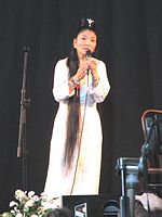 A Tibetan woman with knee-length hair