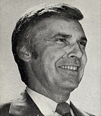 Leo Ryan, a middle aged man wear a suit and tie.