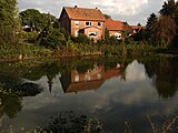 View across the pond in the centre of the village