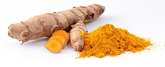 Turmeric powder, first used as a dye, and later as a medicine and spice in South Asian cuisine.
