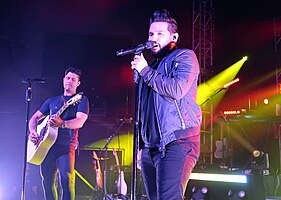 Dan + Shay performing on stage.