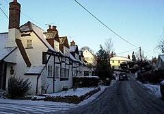 Timber-framed cottages with snow