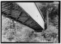 View of wooden covered bridge from below