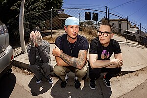 Blink-182 in 2023. Left to right: Travis Barker, Tom DeLonge and Mark Hoppus.