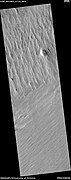 Wide view of yardangs, as seen by HiRISE under HiWish program. This image is odd in that the yardangs are lined up in different directions in the top and bottom part of image. The wind direction probably changed to cause this.