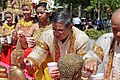 Elders cleanse statues of the Buddha with perfumed water in Cambodia