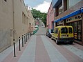 The international road "Rue du Petit Pont" (Le Perthus, left) / "Carrer del Còrrec" (Els Límits, right)