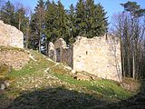 The castle chapel of the lower ward. Left: what is probably the high medieval main gateway. In its state before the renovations