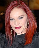 A woman with red hair and lipstick