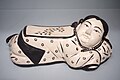 Ceramic pillow in the form of a reclining girl, Jin dynasty