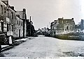 Remungol : la rue principale et le cimetière vers 1920 (carte postale).