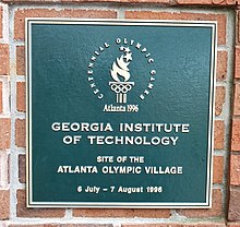 Logo of the Atlanta Olympics, with "Georgia Institute of Technology", "Site of the Atlanta Olympic Village", "6 July – 7 August 1996" written underneath