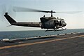 An UH-1N Huey landing on USS Guadalcanal in 1987.