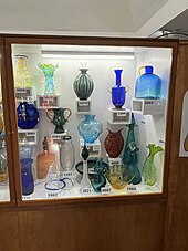 cabinet with various pieces of colored glass