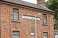 A close up of the historical train station house depicting the sign "Donabate"