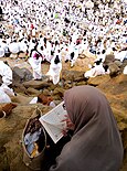 Mount Arafat during Ḥajj with Pilgrims supplicating.