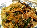 Japchae, a kind of Korean noodle dish made with marinated beef and vegetables in soy sauce and sesame oil.