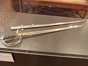 The sword and scabbard which Alexander Oswald Brodie, who served as the Governor of the Territory of Arizona from 1902 to 1905, used during his service with the Rough Riders during the Spanish–American War. The exhibit is located in the second floor of the Arizona State Capitol Museum.