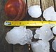 Hailstones dropped during the storm, compared to a cricket ball.