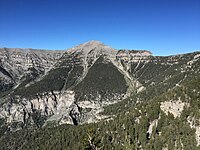 Mountain ridge with a treeless peak in the middle