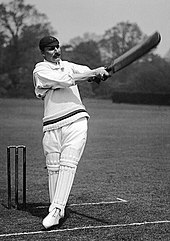 A posed black and white photo of MacLaren batting