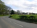 The old 1903 'Lugton High' Stationmaster's house on the left and the much altered railway workers houses on the right.