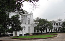 Large white building, with many pillars