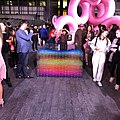 People gathering around the installation artwork Rabbit Hole at the DIFC Artnight 2019 with another work (flamingos) showing behind