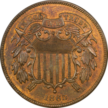 A bronze coin with a shield in the center, dated 1865.