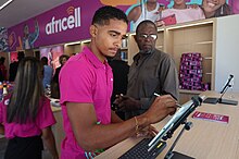 A customer service agent at an Africell store in Luanda, Angola