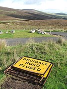 B26 Ballaugh Glen (Druidale) Road at the ‘Brandywell Cottage’ double-hairpin with a north-east aspect towards Slieau Dhoo mountain and Mount Karin.