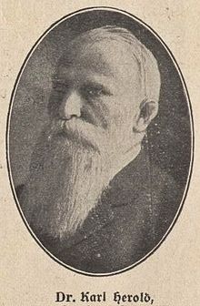 An oval black and white photograph of the politician with white beard, with the caption “Dr. Carl Herold” below it.