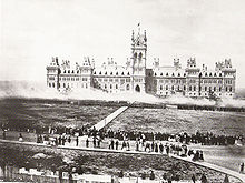 Soldiers giving a feu de joie infront of the Parliament of Canada for the Queen's Birthday Review in 1868