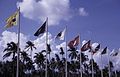 Flags outside Singapore International Airport, photographed February 1969 × July 1971.