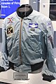 The jacket worn by Michael Collins featuring patches for Apollo 11 and other missions he flew on.