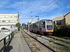 A northbound train passing the southbound platform at Right Of Way/Eucalyptus station, 2017