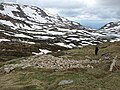 A skier assessing the ruins of Albina Ski Lodge, November 2011.