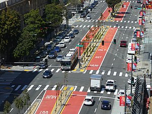 View of an urban arterial with a bus on the red center lanes