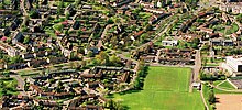 Aerial view of Woodside Road in Glenrothes showing homes, schools, landscaping and roads