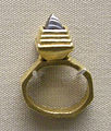 Gold finger ring with garnet inlay (BM)