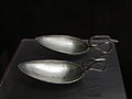 Two large silver spoons with swan shaped handles
