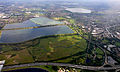 Image 22Seven reservoirs. View of four in Spelthorne with small lakes of lower elevation, from aggregate extraction, in the south of the borough to the right. Beyond three reservoirs in Elmbridge. The flattest areas of the far north of the county. Staines road and rail bridges span the Thames into Runnymede in the right of the photograph. (from Portal:Surrey/Selected pictures)