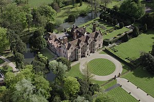 Brick mansion in moat seen from above