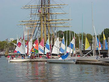 Children learning to sail in JY15s and Dyer Dhows