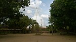 A Buddhist stupa, view obstructed by trees