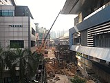 The pedestrian link bridge connecting the station with One World Hotel being constructed as at the end of June 2017.