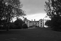 Exterior of quite large country house in extensive gardens