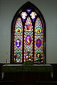 The altar and central stained glass window