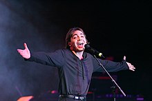 A group of young men singing.